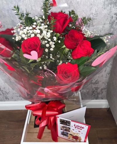 Simply Romantic - A classic bouquet in rich red and crisp white tones, finished with fresh greenery for a beautifully romantic look.